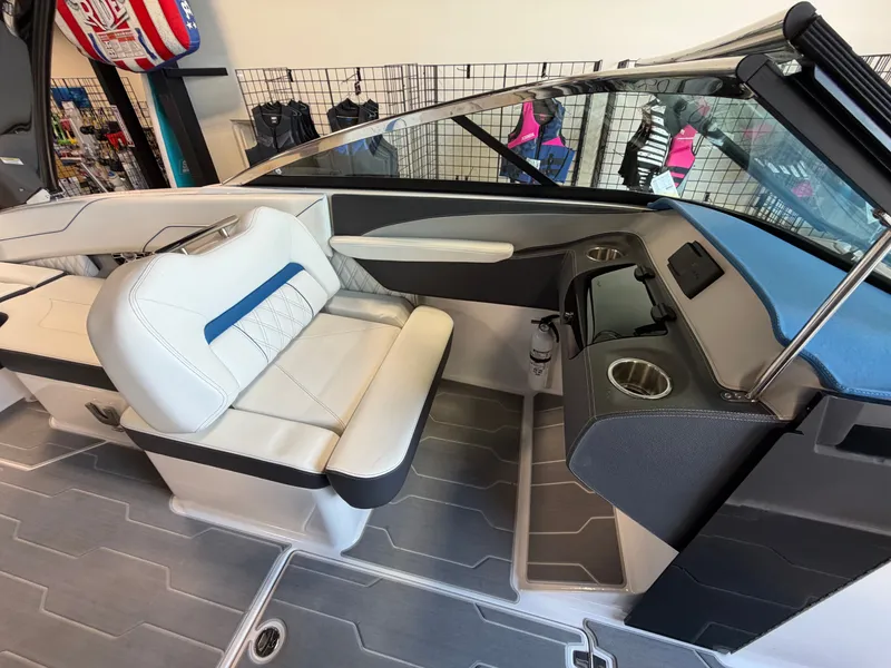 Slide: The Image of Interior of a 2022 Regal LS4 Surf boat with white seating. - 8