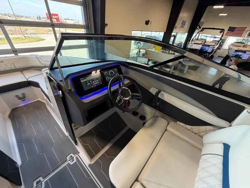 Slide: The Image of Interior of 2022 Regal LS4 Surf boat with modern helm console. - 9