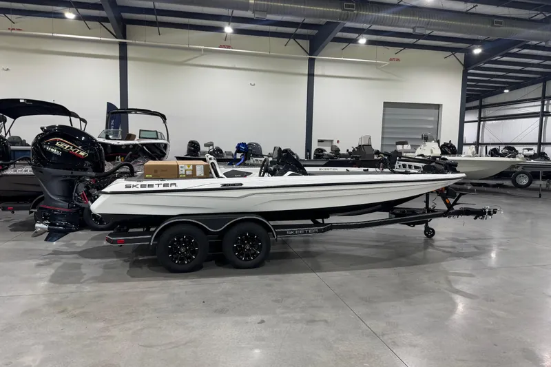 The Image of 2026 Skeeter ZXE20 boat in showroom, featuring sleek design and powerful engine. - 0