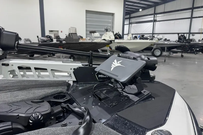 Slide: The Image of 2026 Skeeter ZXE20 boat with advanced navigation system in a showroom. - 3