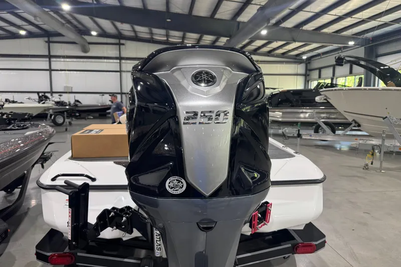 Slide: The Image of 2026 Skeeter ZXE20 boat engine in showroom, showcasing sleek design and power. - 8