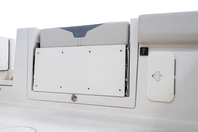 Slide: The Image of 2027 Sailfish 312 CC boat interior, featuring storage compartments and seating area. - 12