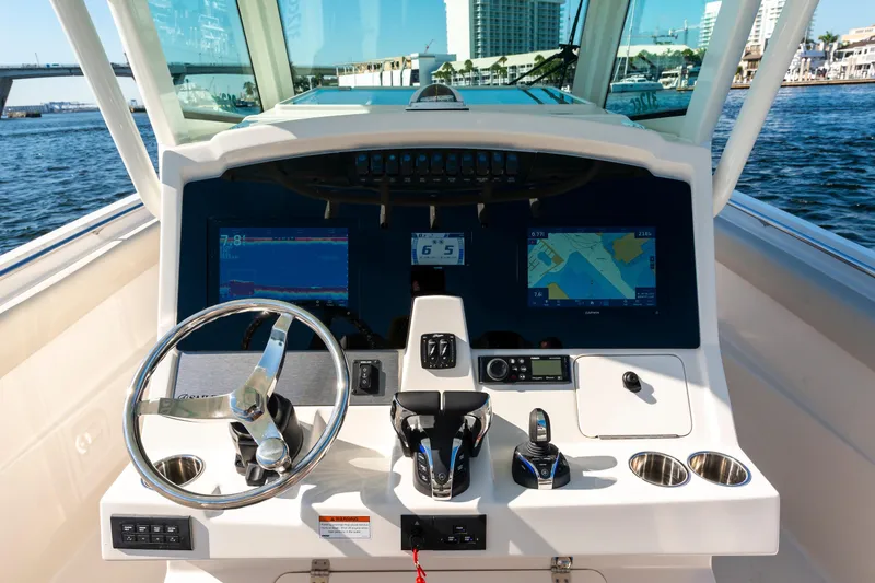Slide: The Image of Cockpit view of 2027 Sailfish 312 CC boat with advanced navigation displays. - 8
