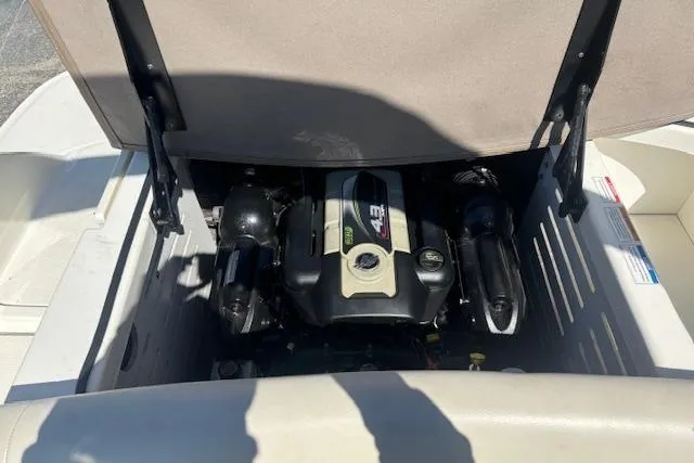 Slide: The Image of Engine compartment of a 2012 Sea Ray 210 SLX boat, showcasing the engine details. - 12