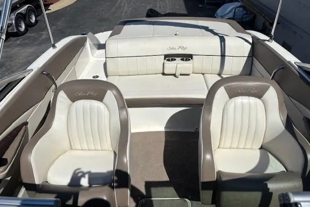 Slide: The Image of 2012 Sea Ray 210 SLX boat interior with beige and white seating. - 5