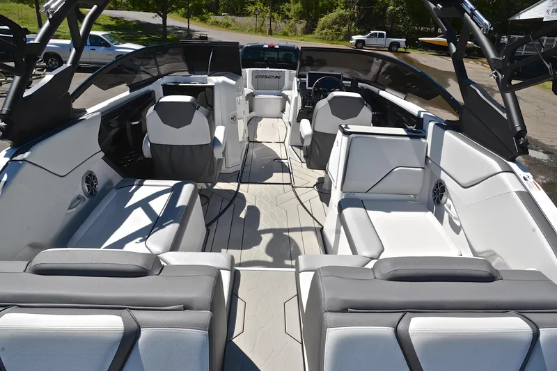 Slide: The Image of 2024 Yamaha Boats 252XE interior showcasing sleek seating and modern design. - 18