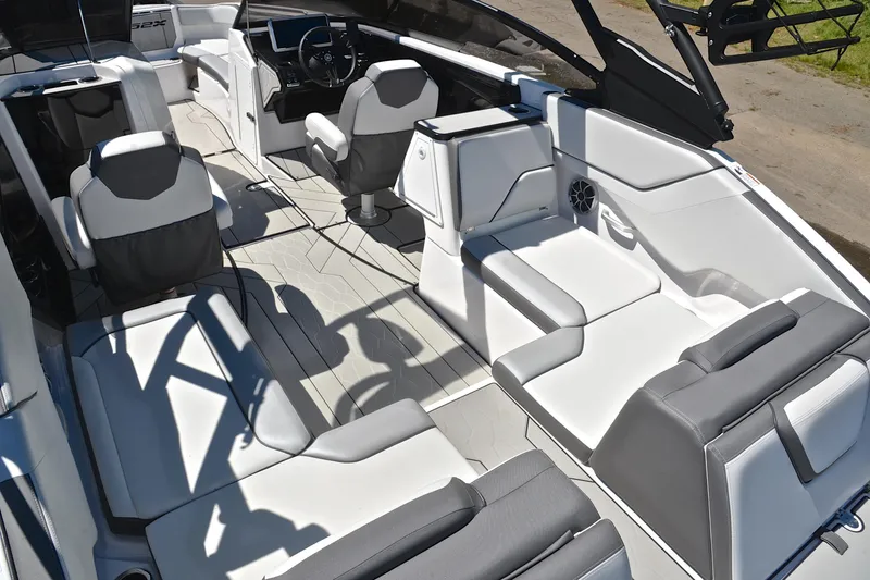 Slide: The Image of 2024 Yamaha Boats 252XE interior, featuring sleek seating and modern design elements. - 23