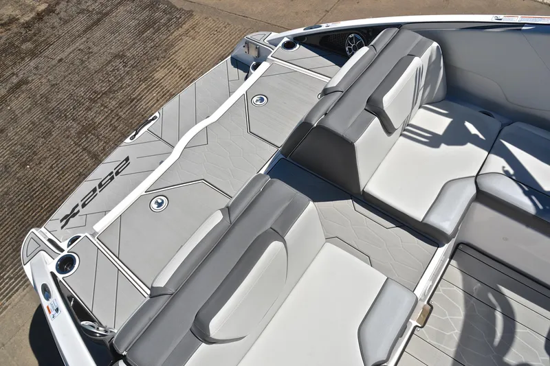 Slide: The Image of 2024 Yamaha Boats 252XE interior seating with sleek, modern design and comfortable upholstery. - 24