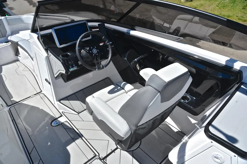 Slide: The Image of 2024 Yamaha Boats 252XE cockpit with modern steering and dashboard design. - 25