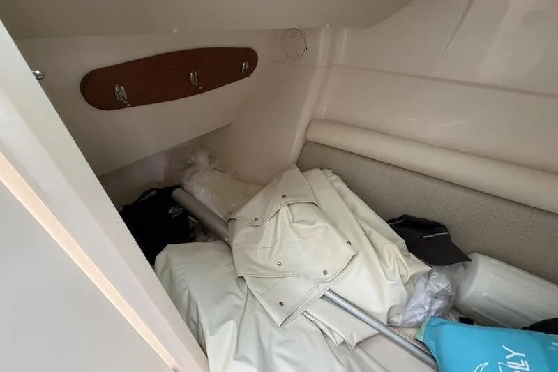 Slide: The Image of Interior cabin of 2025 Grady-White Freedom 325 boat with stored items. - 16