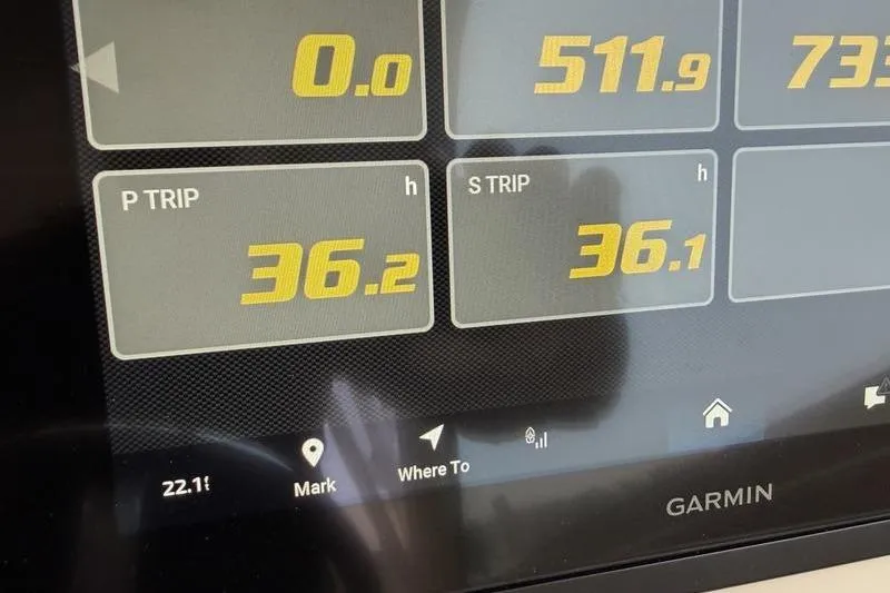 Slide: The Image of Garmin display on 2025 Grady-White Freedom 325 showing trip data and navigation options. - 18