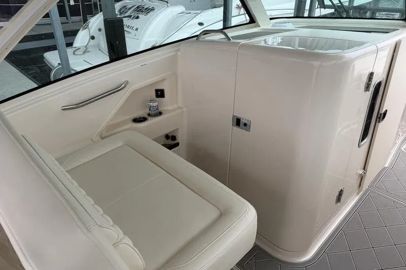 Slide: The Image of 2025 Grady-White Freedom 325 boat interior with seating and storage area. - 24