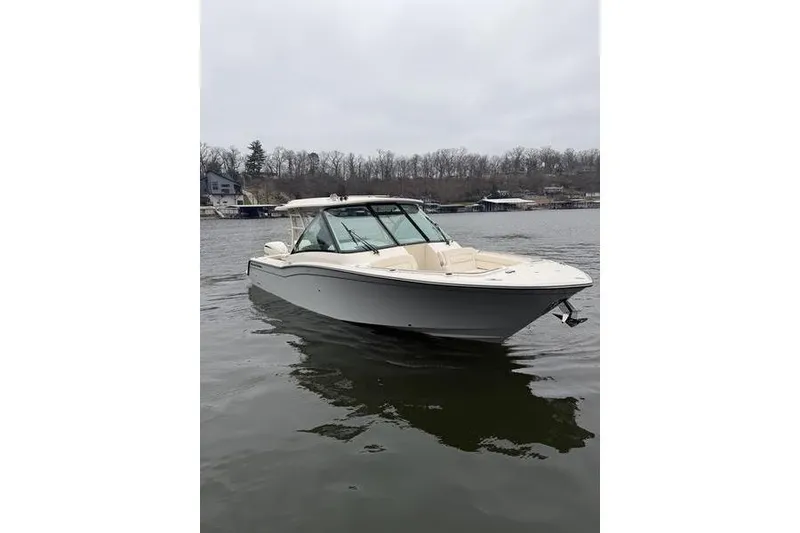 Slide: The Image of 2025 Grady-White Freedom 325 boat on a calm lake. - 5