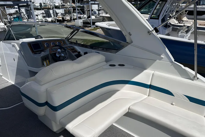 Slide: The Image of 2006 Formula 280 Bowrider interior with white seating and dashboard controls. - 11