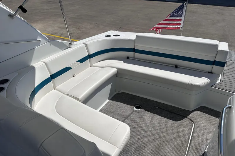 Slide: The Image of 2006 Formula 280 Bowrider boat interior with white seating and American flag. - 12