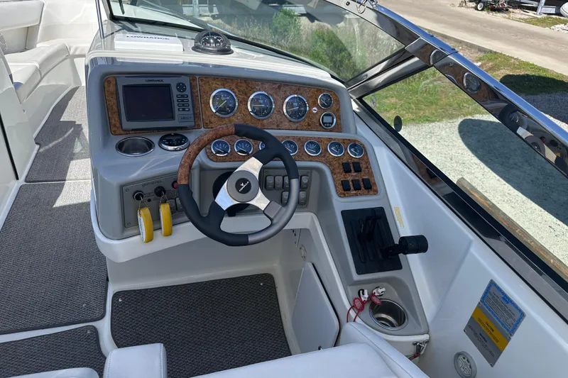 Slide: The Image of Steering console of a 2006 Formula 280 Bowrider boat with gauges and controls. - 14