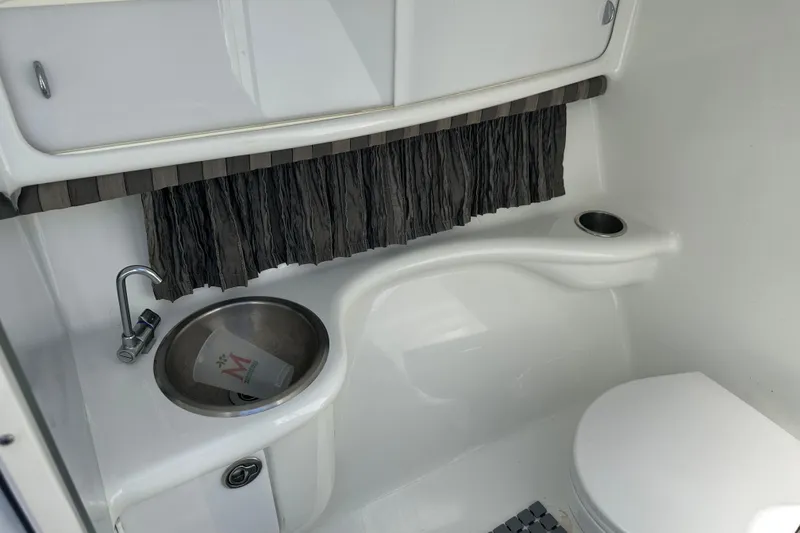 Slide: The Image of 2006 Formula 280 Bowrider boat bathroom with sink and toilet. - 19