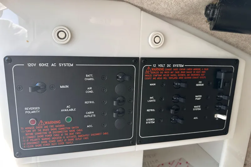 Slide: The Image of Control panel of a 2006 Formula 280 Bowrider boat, showing AC and DC systems. - 21