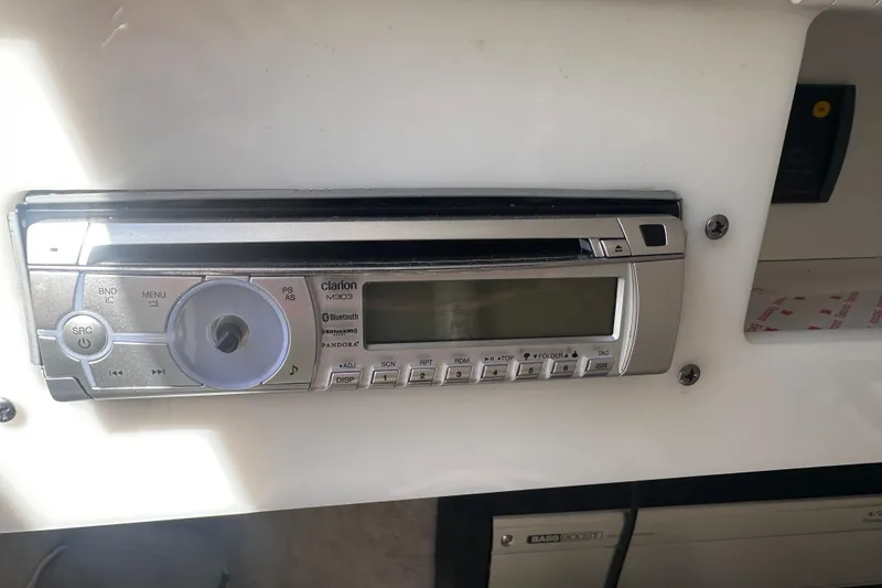 Slide: The Image of Clarion M303 stereo system in a 2006 Formula 280 Bowrider boat dashboard. - 22