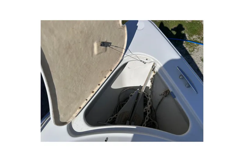 Slide: The Image of Open anchor compartment on 2006 Formula 280 Bowrider boat, showing anchor and chain storage. - 25