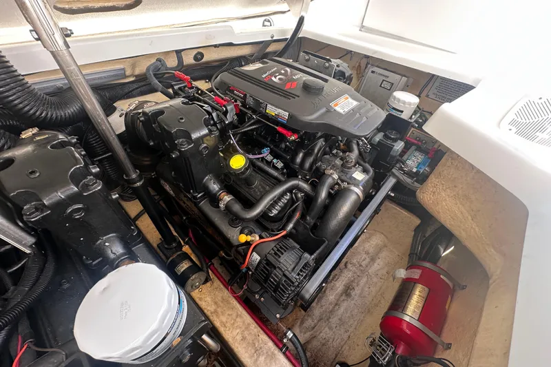 Slide: The Image of Engine compartment of a 2006 Formula 280 Bowrider boat, showcasing mechanical components. - 27