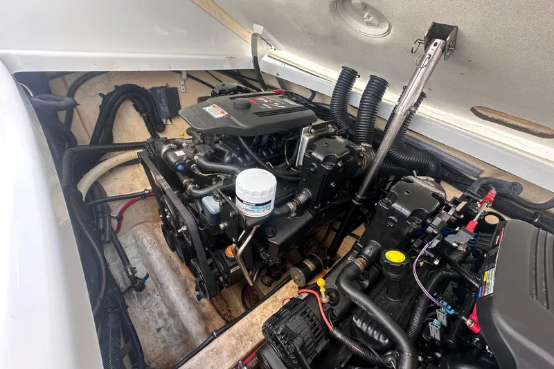 Slide: The Image of Engine compartment of a 2006 Formula 280 Bowrider boat, showcasing detailed mechanical components. - 28