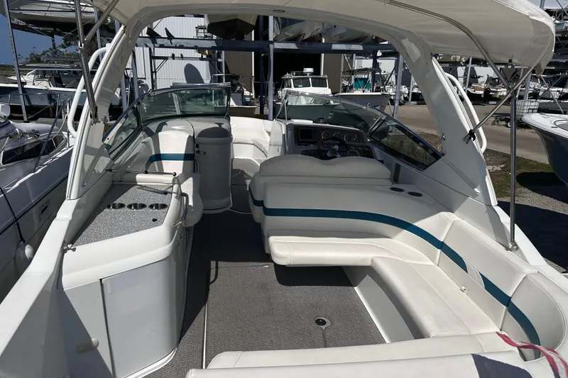 Slide: The Image of 2006 Formula 280 Bowrider boat interior with white seating and dashboard. - 3
