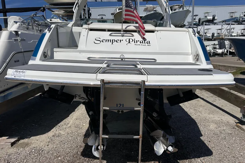 Slide: The Image of Rear view of 2006 Formula 280 Bowrider boat with American flag and "Semper Pirata" text. - 4
