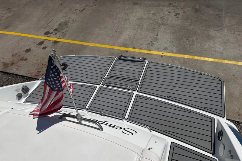 Slide: The Image of 2006 Formula 280 Bowrider boat with American flag, docked on concrete surface. - 5