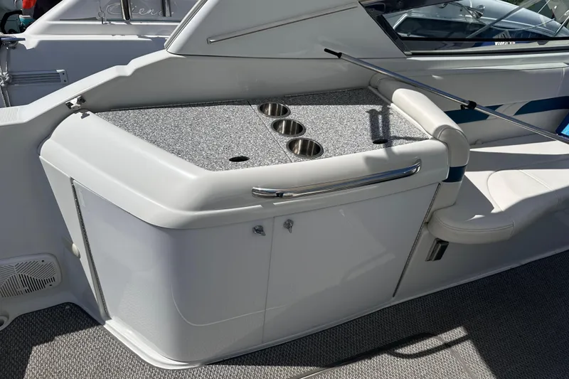 Slide: The Image of 2006 Formula 280 Bowrider boat interior with cup holders and seating area. - 7