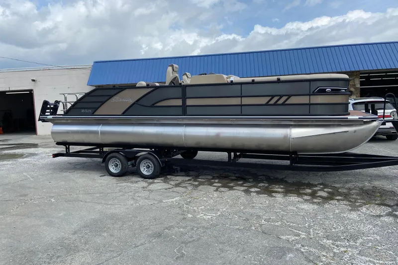 The Image of 2026 Bentley Pontoons 25 Elite Swingback on trailer, side view. - 1