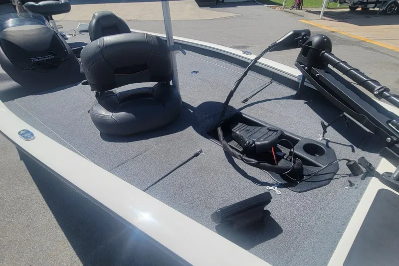 Slide: The Image of 2022 Tracker Pro Team 175 TXW boat deck with seating and fishing equipment. - 10