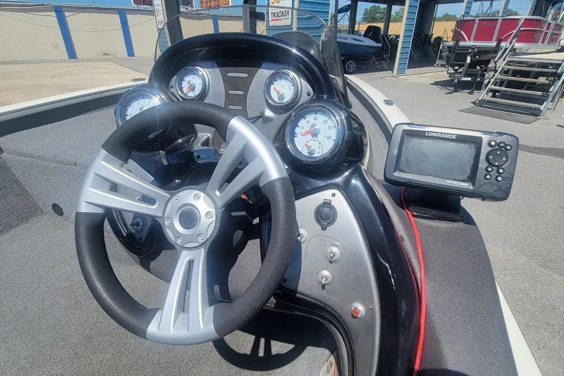 Slide: The Image of Steering console of 2022 Tracker Pro Team 175 TXW boat with gauges and Lowrance fishfinder. - 12
