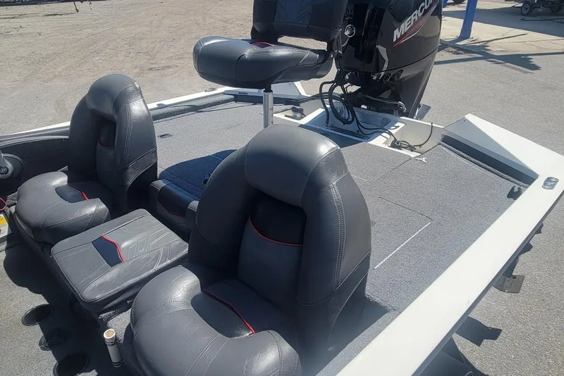 Slide: The Image of 2022 Tracker Pro Team 175 TXW boat interior with seating and Mercury engine. - 14