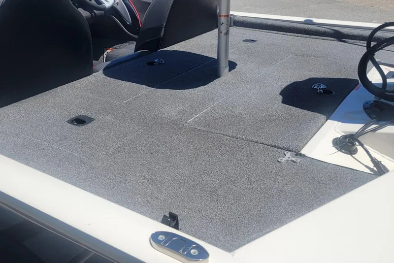 Slide: The Image of 2022 Tracker Pro Team 175 TXW boat deck with gray carpeting and seating area. - 15