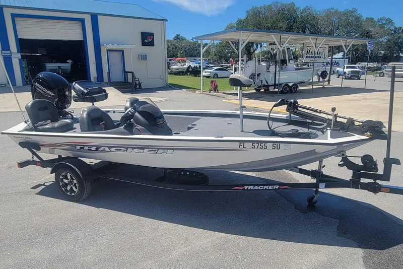 Slide: The Image of 2022 Tracker Pro Team 175 TXW boat on trailer, parked outside dealership. - 4