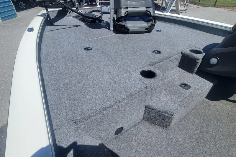 Slide: The Image of 2022 Tracker Pro Team 175 TXW boat deck with gray carpet and seating. - 7