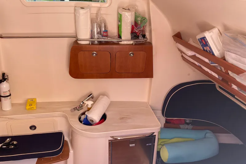 Slide: The Image of Interior of 2021 Grady-White Canyon 376 boat with storage and amenities. - 10