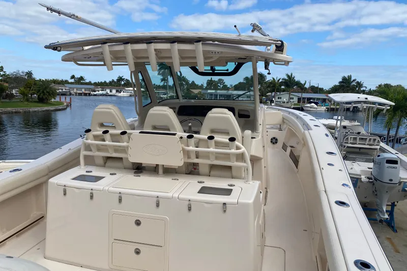 Slide: The Image of 2021 Grady-White Canyon 376 boat docked by a scenic waterfront. - 20