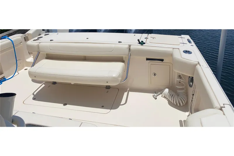 Slide: The Image of 2021 Grady-White Canyon 376 boat interior with seating and storage compartments. - 24