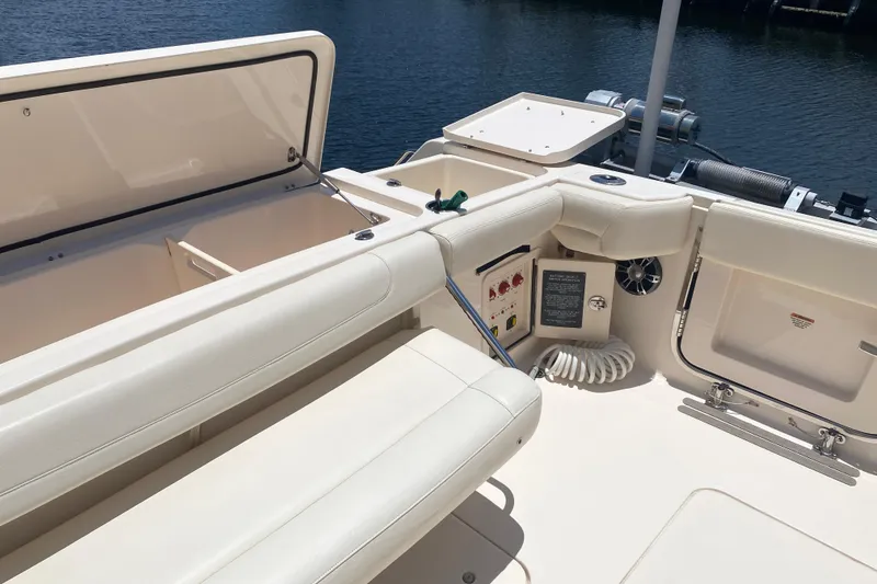 Slide: The Image of 2021 Grady-White Canyon 376 boat interior with seating and storage compartments. - 25
