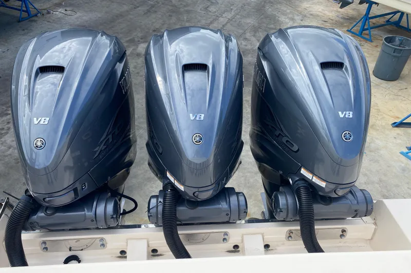 Slide: The Image of Triple Yamaha V8 outboard engines on a 2021 Grady-White Canyon 376 boat. - 27