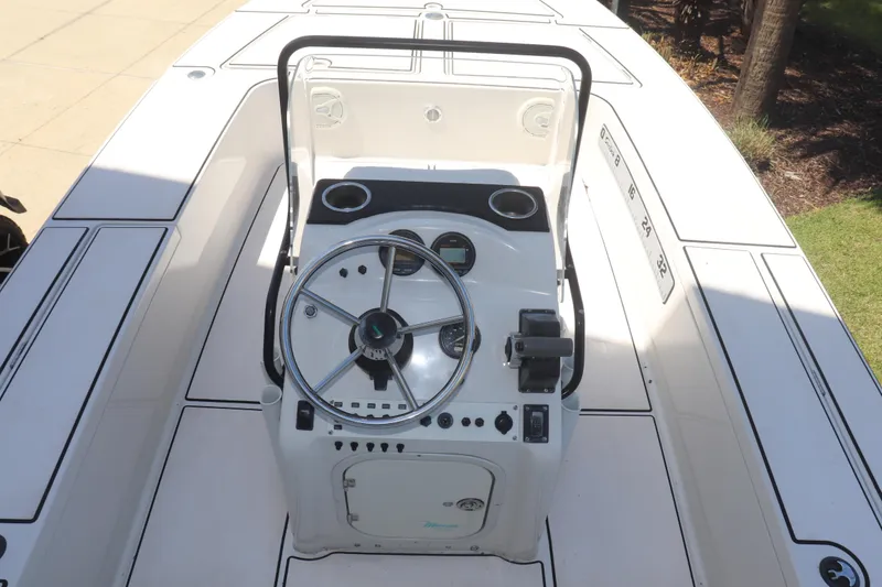 Slide: The Image of 2001 Maverick 21 Master Angler boat console with steering wheel and controls. - 10