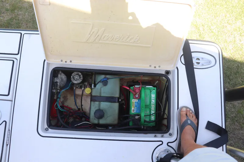 Slide: The Image of Open hatch of 2001 Maverick 21 Master Angler showing battery and wiring. - 11