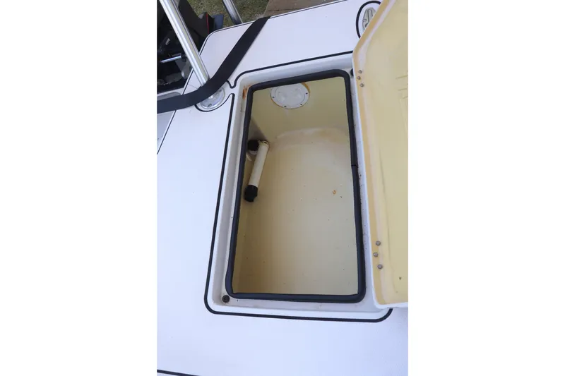 Slide: The Image of Open storage compartment on a 2001 Maverick 21 Master Angler boat. - 12