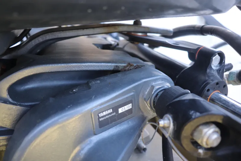 Slide: The Image of Close-up of a Yamaha engine component on a 2001 Maverick 21 Master Angler boat. - 15