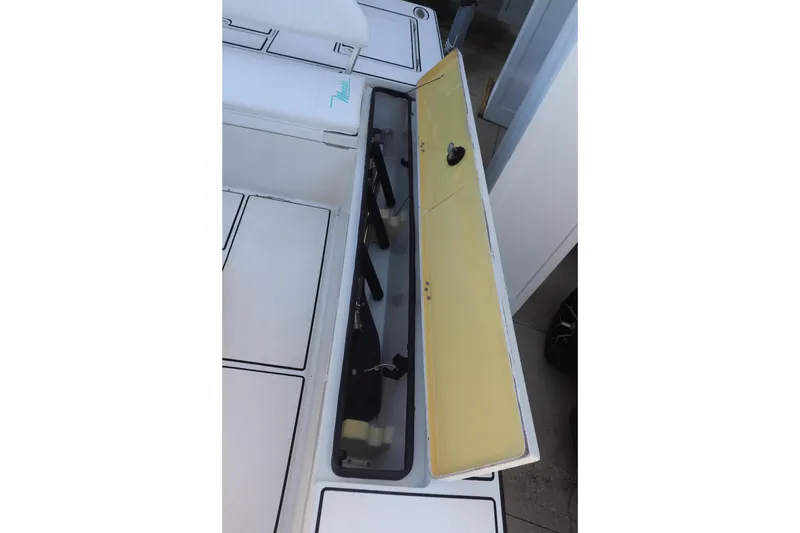 Slide: The Image of Open storage compartment on 2001 Maverick 21 Master Angler boat, showcasing interior space. - 6