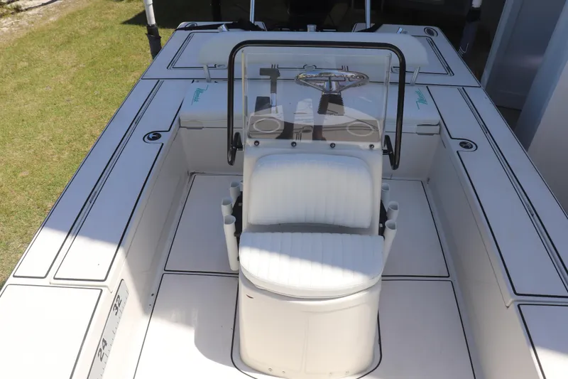 Slide: The Image of 2001 Maverick 21 Master Angler boat interior with steering console and seating. - 8