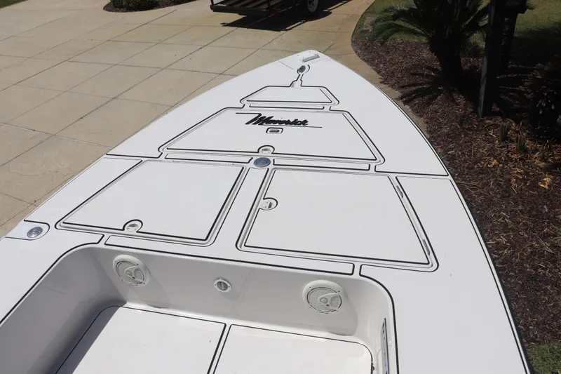Slide: The Image of 2001 Maverick 21 Master Angler boat deck with storage compartments and logo. - 9