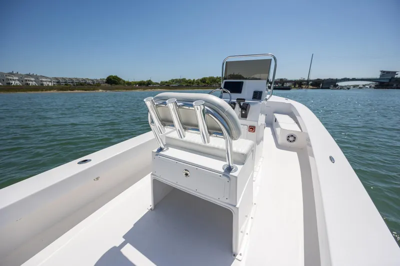 Slide: The Image of StroudCraft 2000 boat, 2026 model, on calm water with clear blue sky. - 10